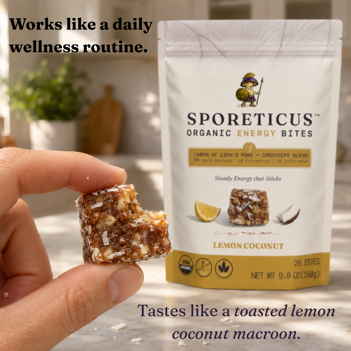 A hand holds a bitten square energy bite showing its brown and white texture, with the Sporeticus Organic Energy Bites Lemon Coconut pouch standing behind it on a light surface. Text overlays describe the product and flavor.