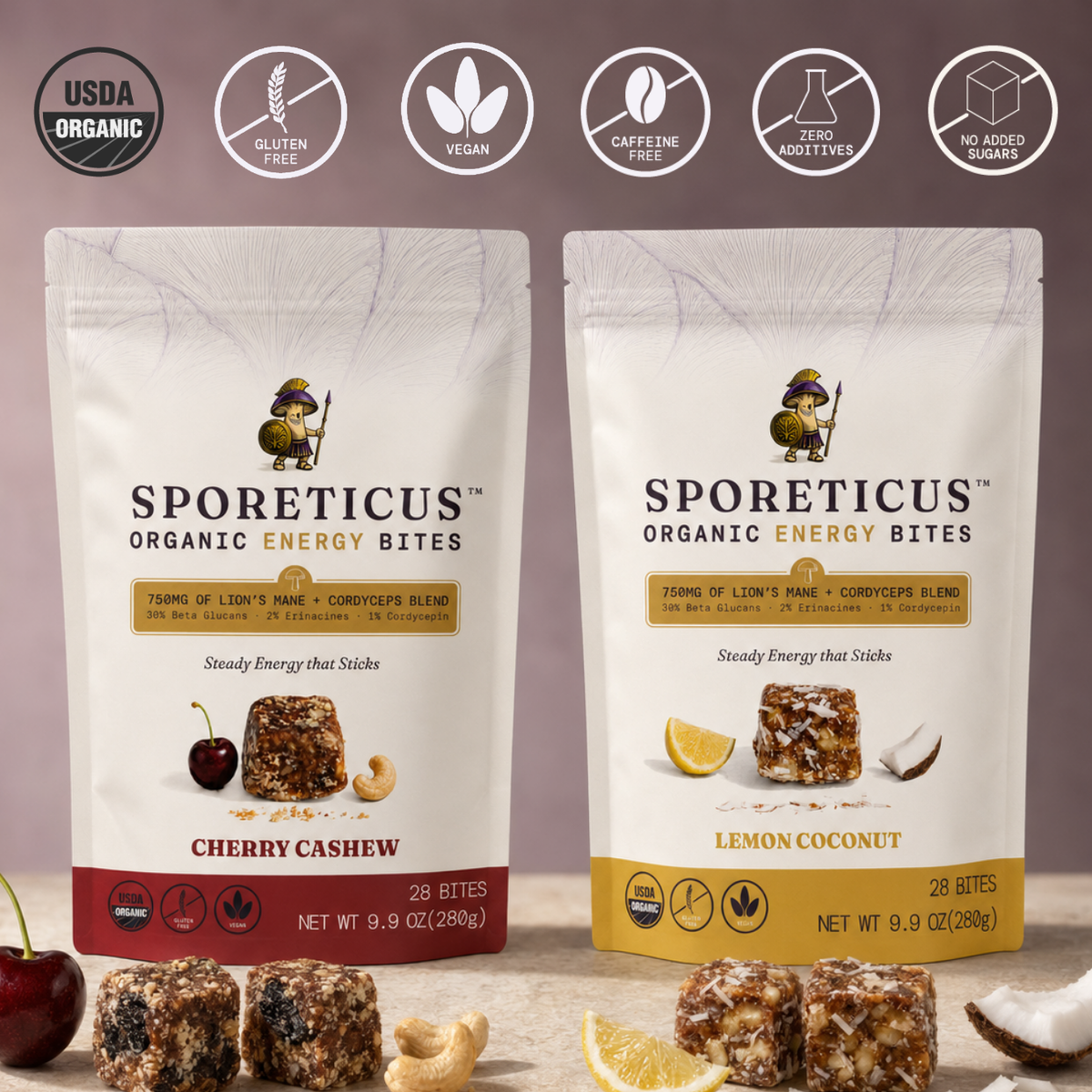 Two stand-up pouches of Sporeticus Organic Energy Bites are shown side by side on a beige surface with ingredient props. The left pouch is Cherry Cashew with a red band at the bottom, and the right pouch is Lemon Coconut with a yellow band at the bottom.