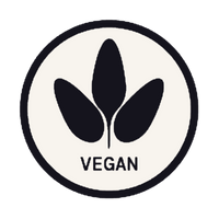 A circular vegan logo featuring three dark navy leaf shapes above the word 'VEGAN' in dark navy text on an off-white background, enclosed in a dark navy circle with a thin dark navy border.